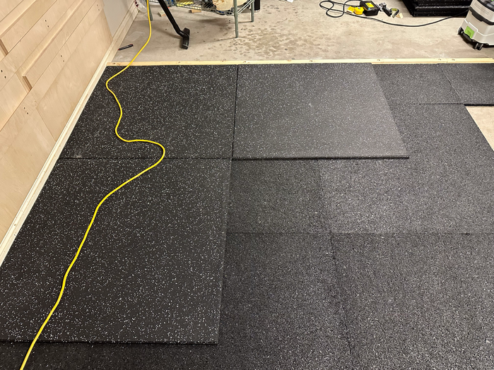 A1 Olympact Rubber Underlay installation under gym tiles