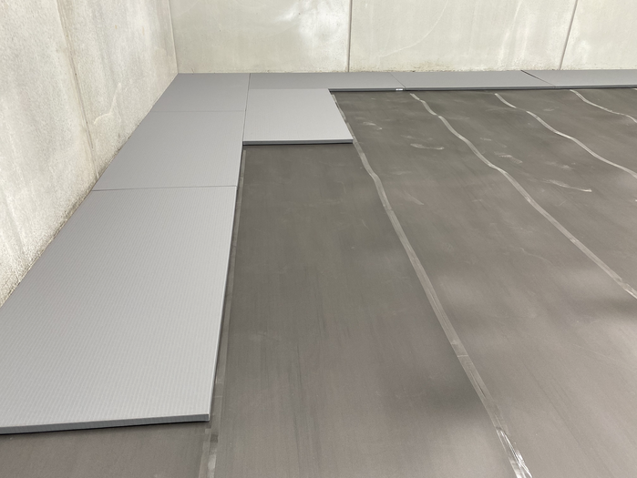 Fuji Mats Underlay being installed under MMA Mats